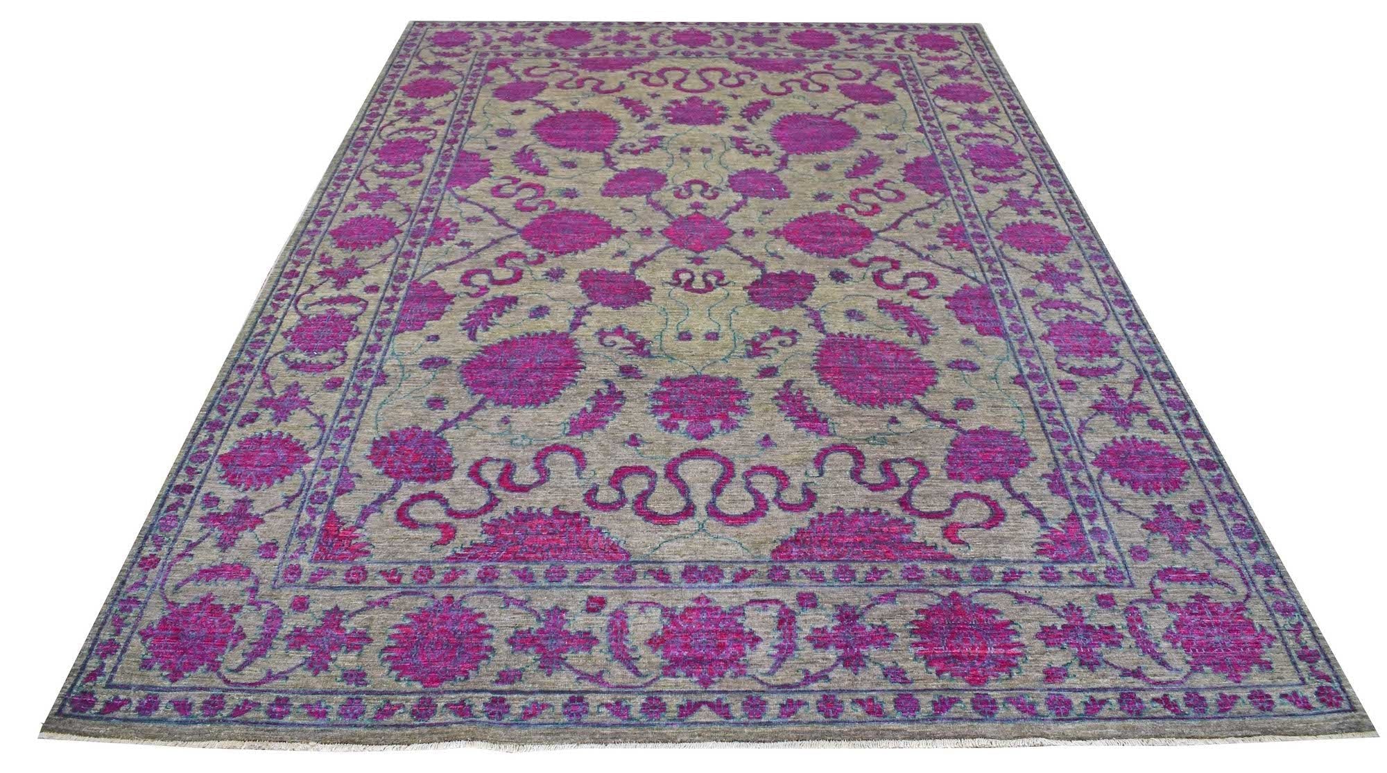 A rectangular Afghan Chobi rug featuring a floral pattern in vibrant magenta on a beige background.