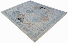 A handwoven Afghan Chobi rug featuring a traditional floral pattern in blue and tan tones.