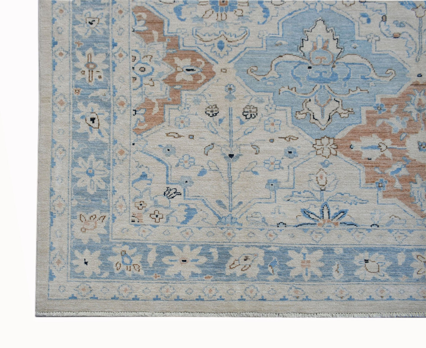 A handwoven Afghan Chobi rug featuring a traditional floral pattern in blue, beige, and tan.