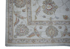 A handmade Afghan Chobi rug featuring traditional floral patterns in soft, earthy tones.