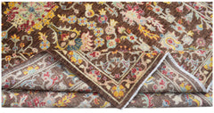 A handwoven Afghan Chobi rug featuring a traditional floral pattern in earthy tones.