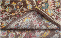 A handwoven Afghan Chobi rug featuring a traditional floral pattern in brown, red, and yellow.