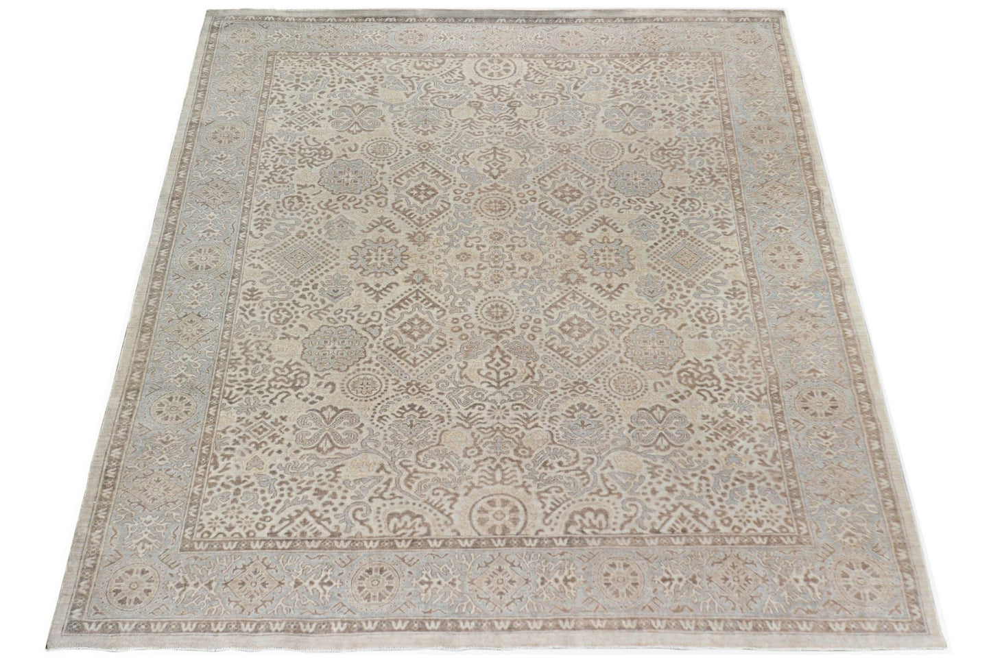 A handmade Afghan Chobi rug featuring a traditional intricate pattern in soft beige and brown tones.