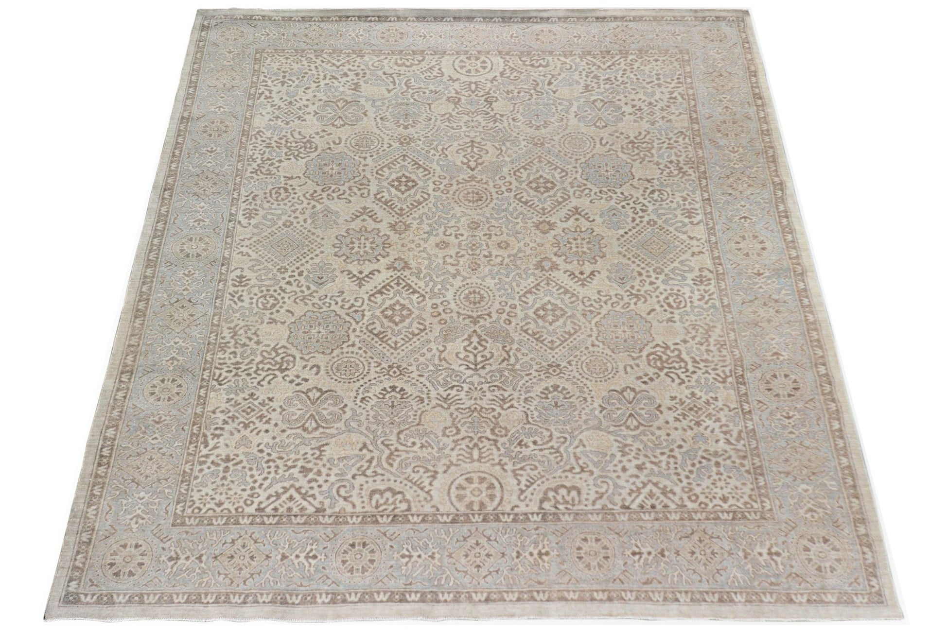 A handmade Afghan Chobi rug featuring a traditional intricate pattern in soft beige and brown tones.