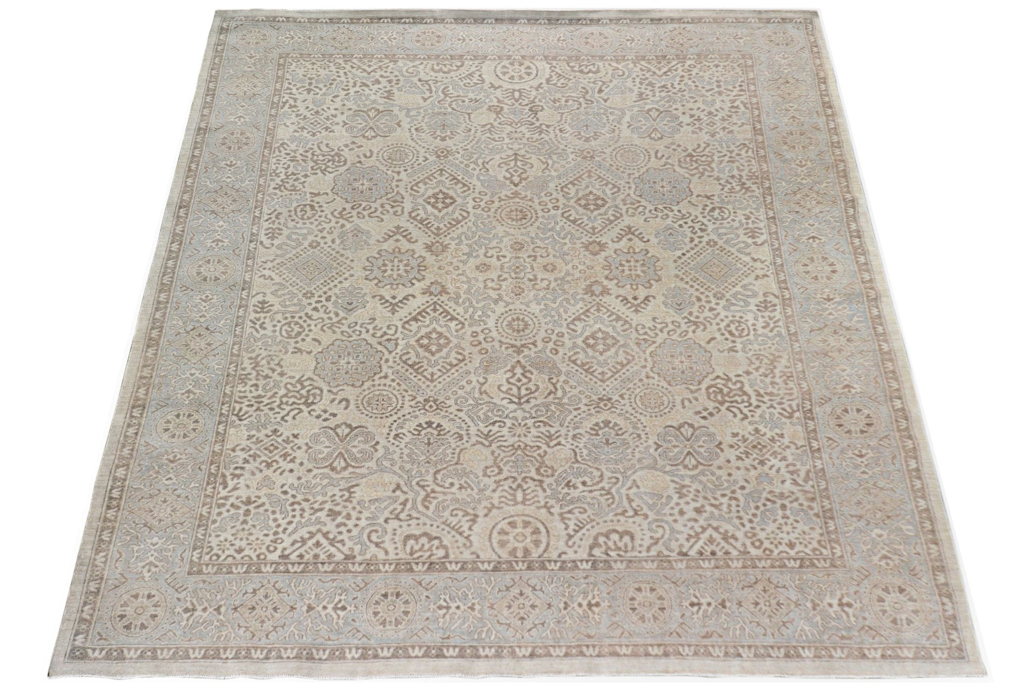 A handmade Afghan Chobi rug featuring a traditional intricate pattern in soft beige and brown tones.