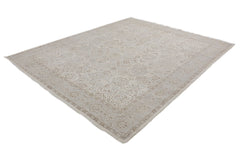 A handmade Afghan Chobi rug featuring a traditional intricate pattern in neutral beige tones.