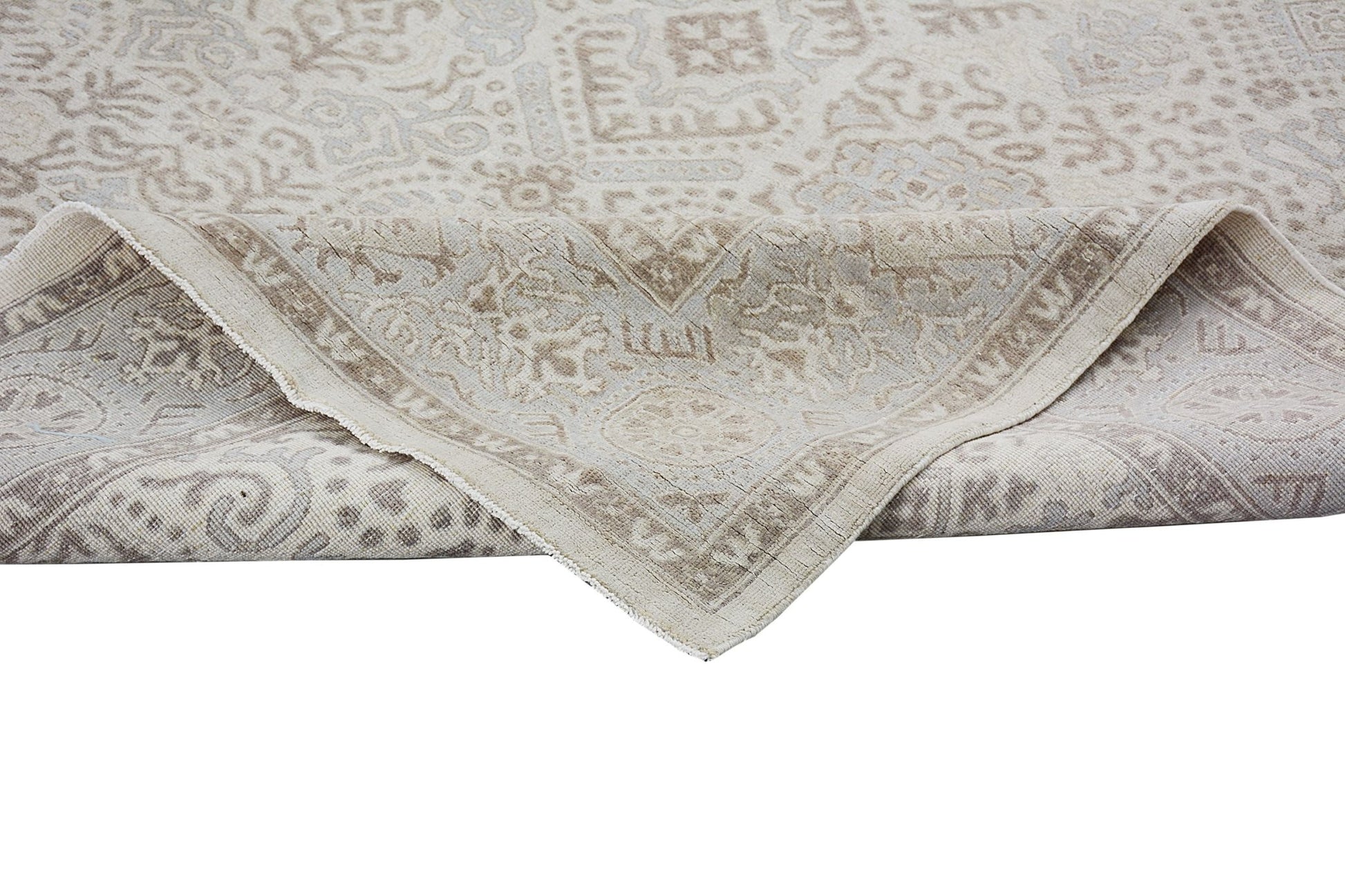 A handmade Afghan Chobi rug featuring a traditional beige and light brown patterned design.
