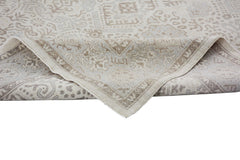 A handmade Afghan Chobi rug featuring a traditional beige and light brown patterned design.