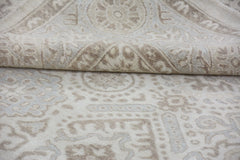 A handmade Afghan Chobi rug featuring a traditional beige and cream geometric pattern.
