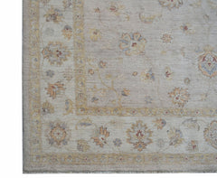A handwoven Afghan Chobi rug featuring a traditional floral pattern in soft, earthy tones.