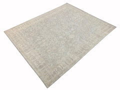 A rectangular Afghan Chobi rug featuring a traditional floral pattern in soft beige and grey tones.