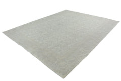 A handmade Afghan Chobi rug featuring a subtle, light-toned traditional pattern.