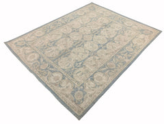 Handmade Afghan Chobi rug featuring a traditional floral pattern in soft blue and beige tones.