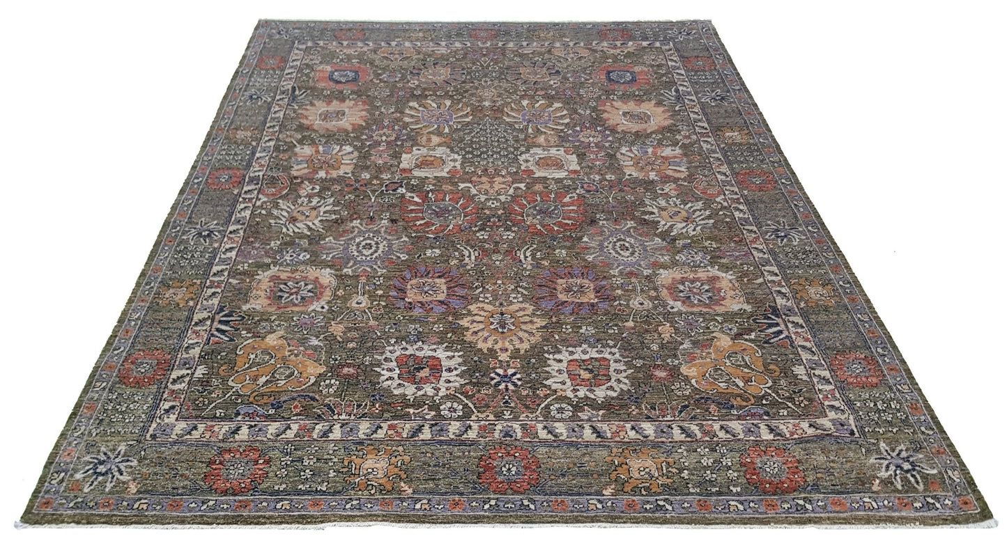 A handwoven Afghan Chobi rug featuring a traditional floral pattern in earthy, muted tones.