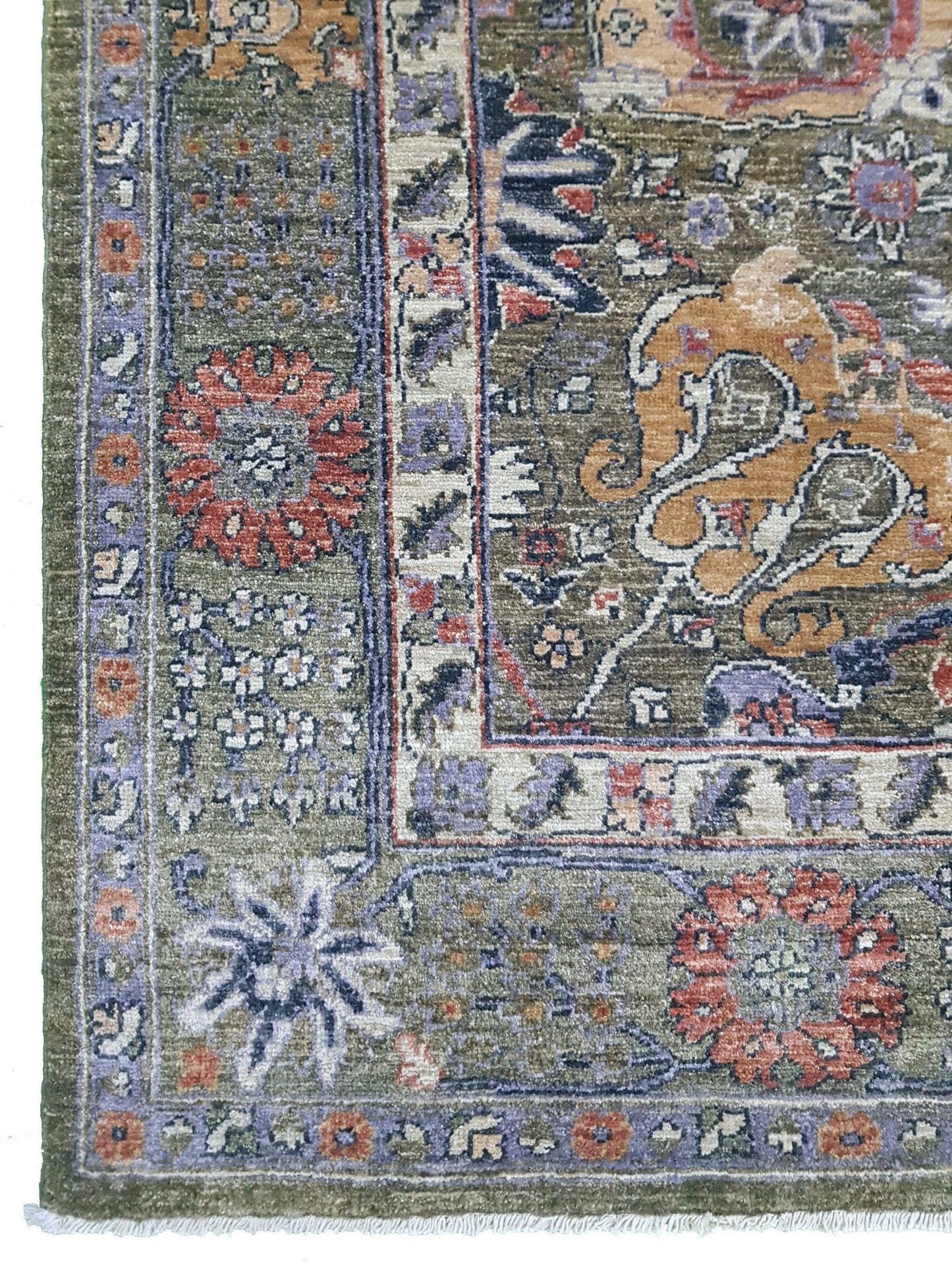 A handwoven Afghan Chobi rug featuring intricate floral patterns in earthy tones on a green field.