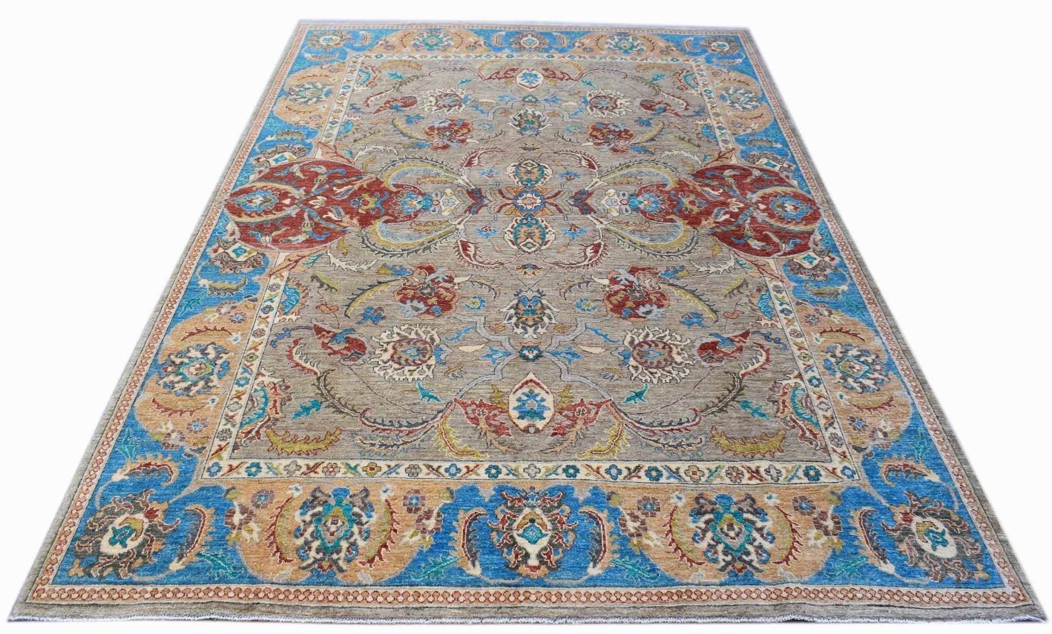 A rectangular Afghan Chobi rug featuring a traditional floral pattern in blue, red, and tan tones.
