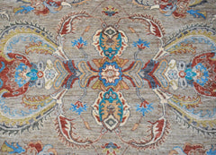 A handwoven Afghan Chobi rug featuring a traditional floral medallion pattern in earthy tones.