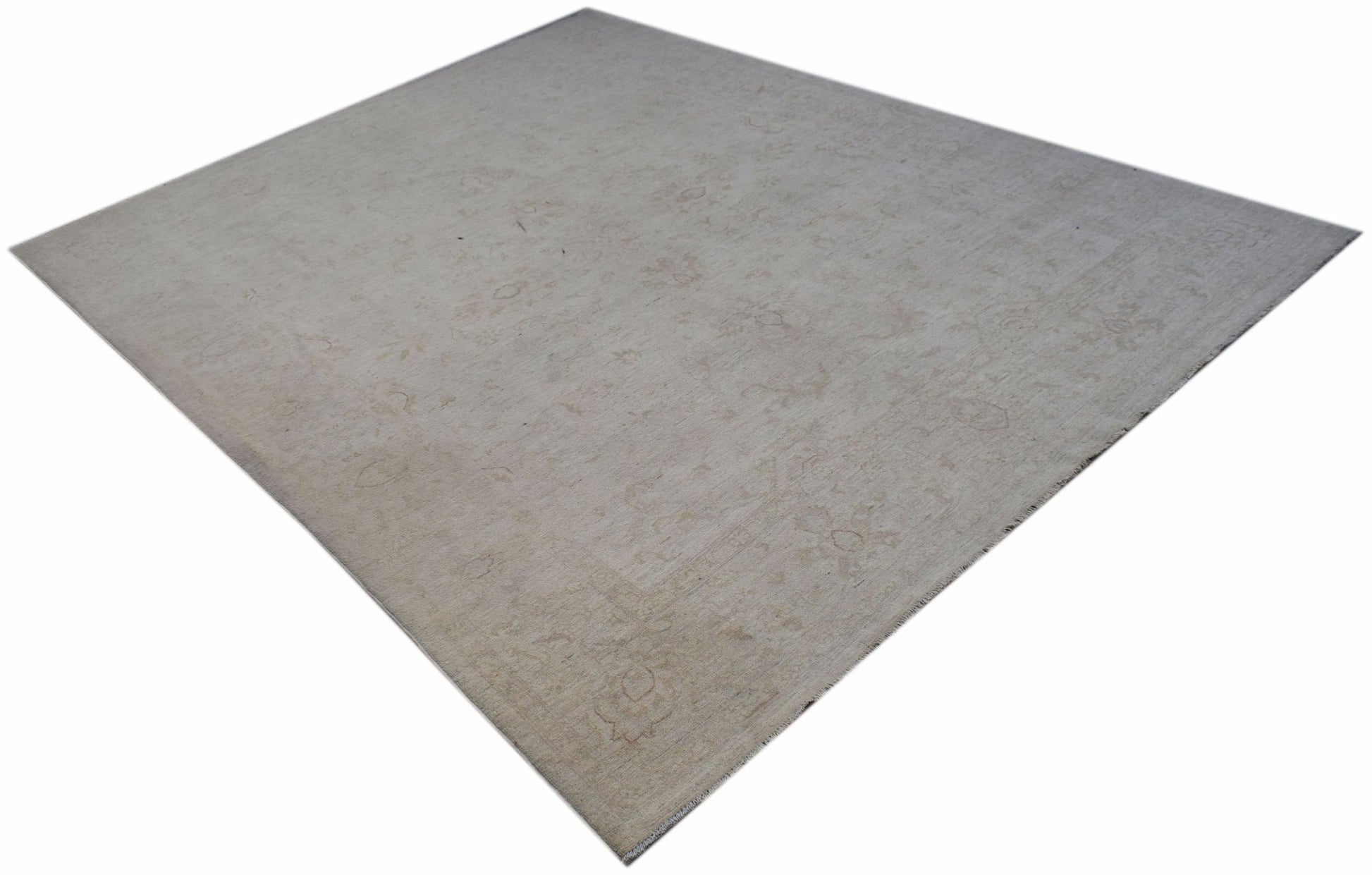 A rectangular Afghan Chobi rug featuring a subtle, light-toned floral pattern on wool.