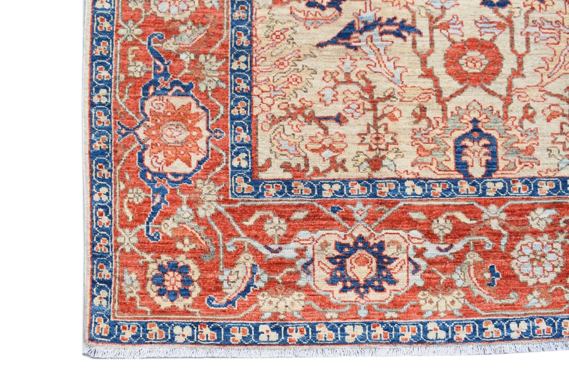 A handmade Afghan Chobi rug featuring a traditional floral pattern in red, blue, and cream tones.