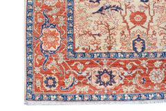 A handmade Afghan Chobi rug featuring a traditional floral pattern in red, blue, and cream tones.