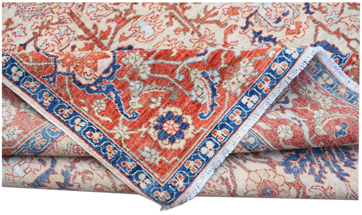 A handmade Afghan Chobi rug featuring a traditional floral pattern in red, blue, and cream tones.