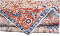 A handmade Afghan Chobi rug featuring a traditional floral pattern in red, blue, and cream tones.