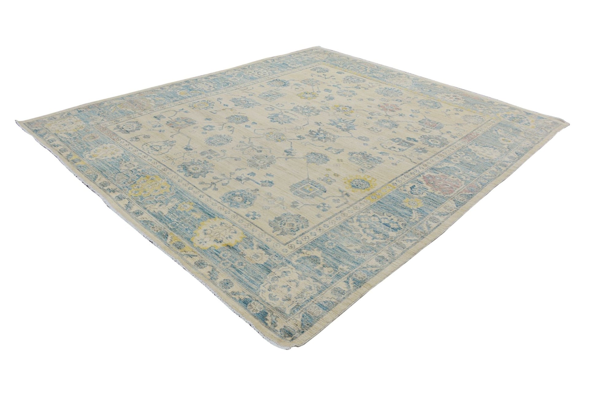 An Afghan Chobi rug featuring a traditional floral pattern in shades of blue, yellow, and cream.