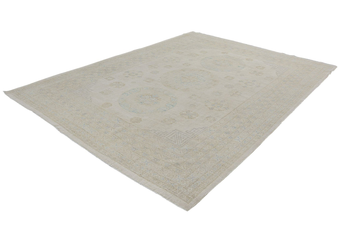An Afghan Chobi rug featuring a traditional medallion pattern in soft beige and blue tones.