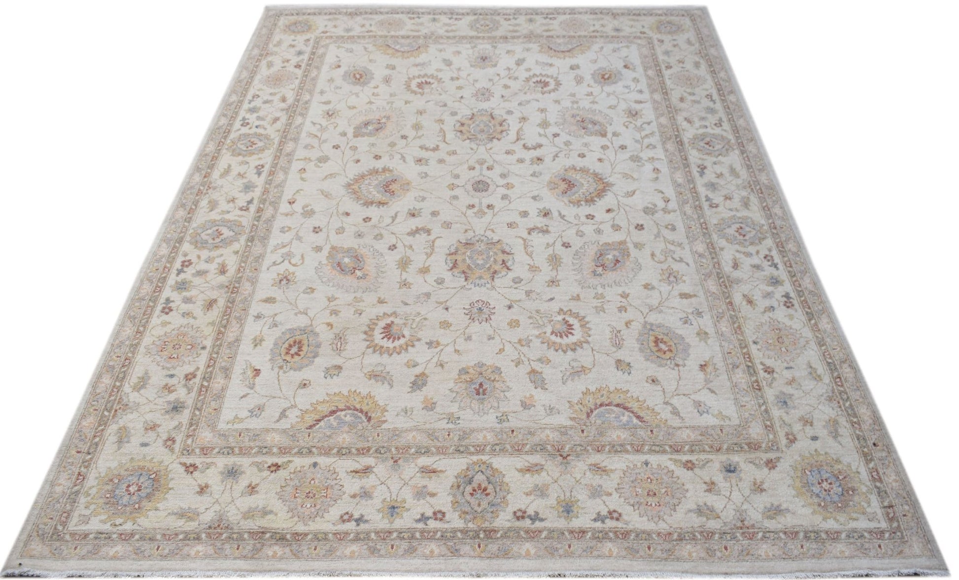 An Afghan Chobi rug featuring a traditional floral pattern in soft, earthy tones.