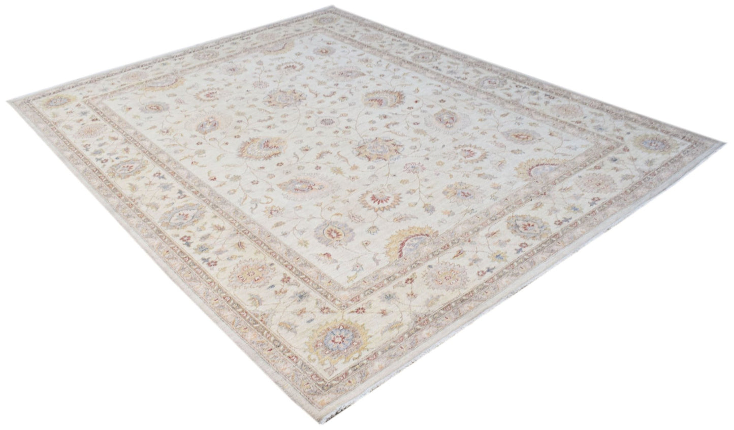 A rectangular Afghan Chobi rug featuring a traditional floral pattern in soft, neutral tones.
