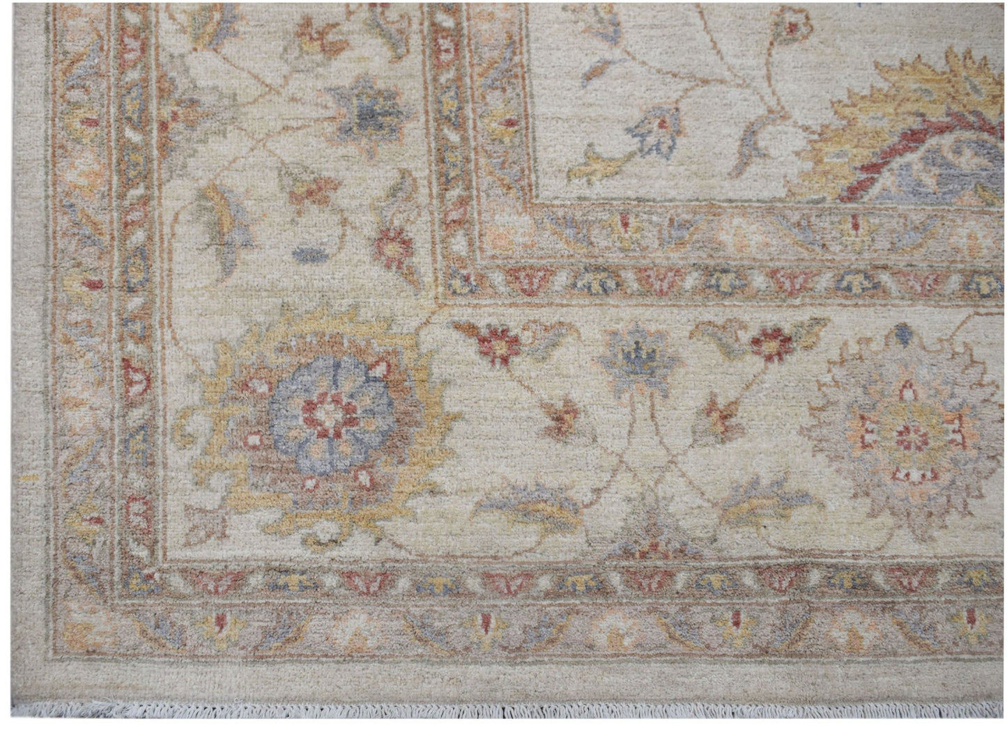 A handmade Afghan Chobi rug featuring a traditional floral pattern in soft, earthy tones.