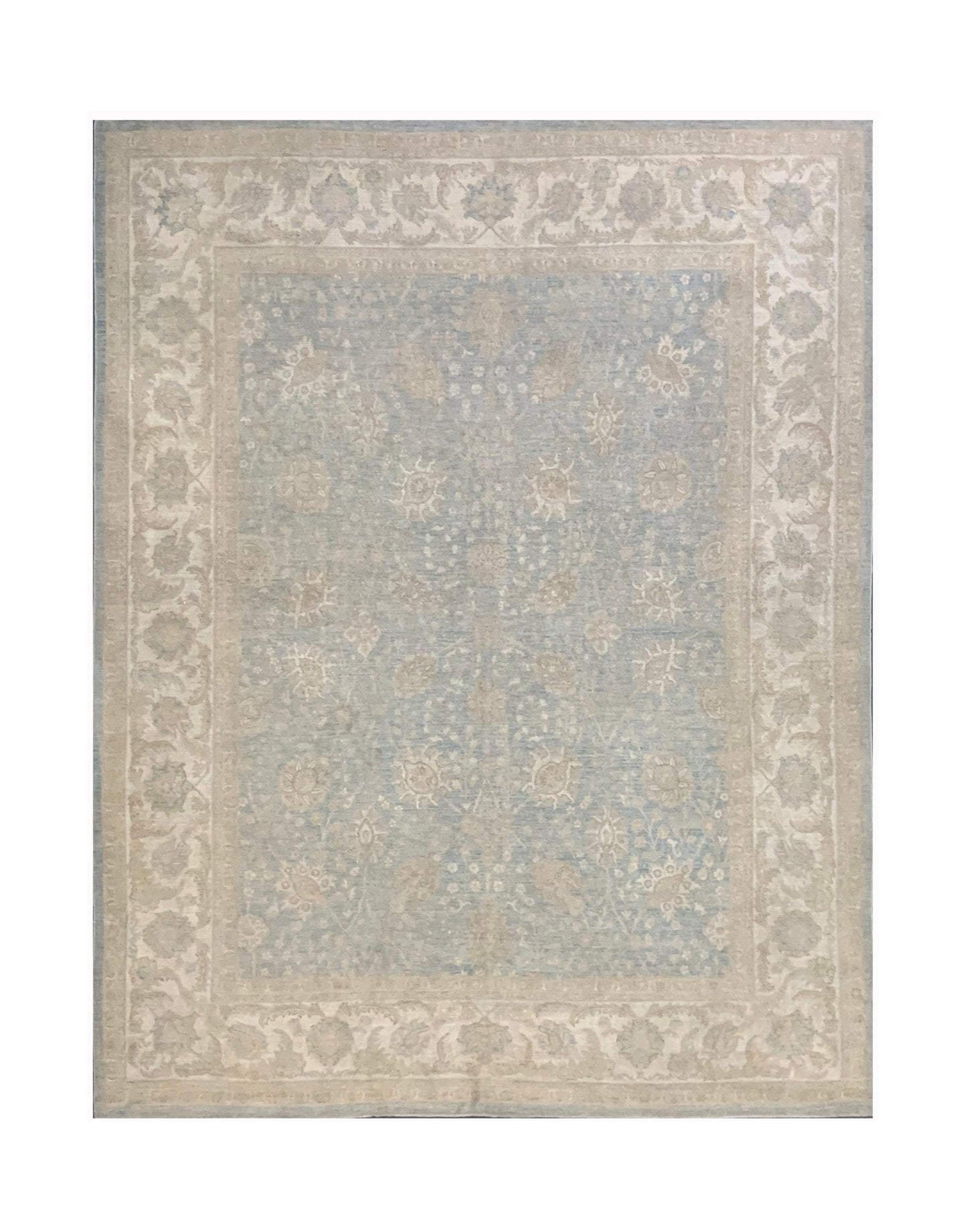A handmade Afghan Chobi rug featuring a light blue field with beige floral patterns and a border.