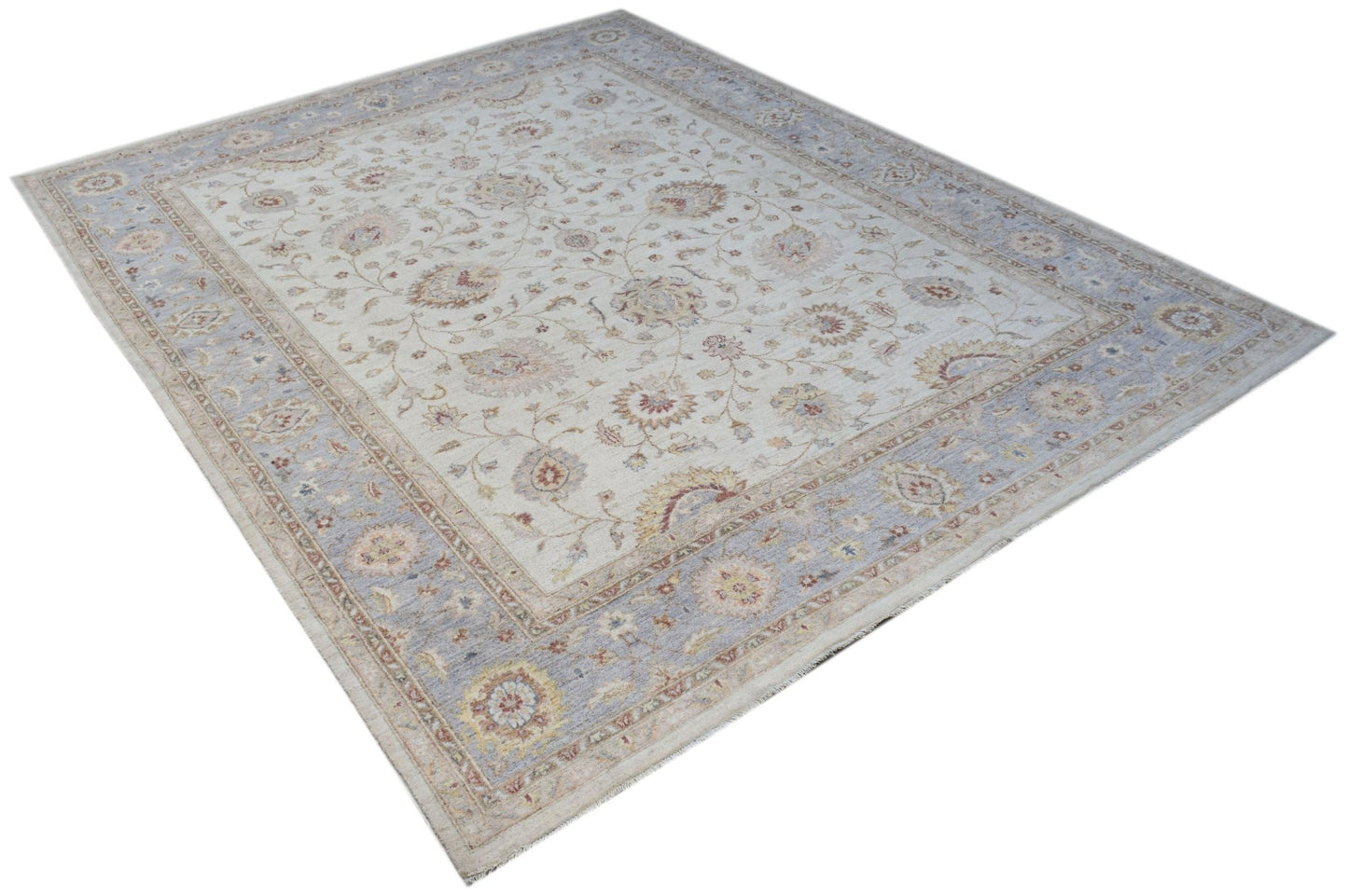 A rectangular Afghan Chobi rug featuring a traditional floral pattern in soft blue and beige tones.