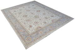 A rectangular Afghan Chobi rug featuring a traditional floral pattern in soft blue and beige tones.