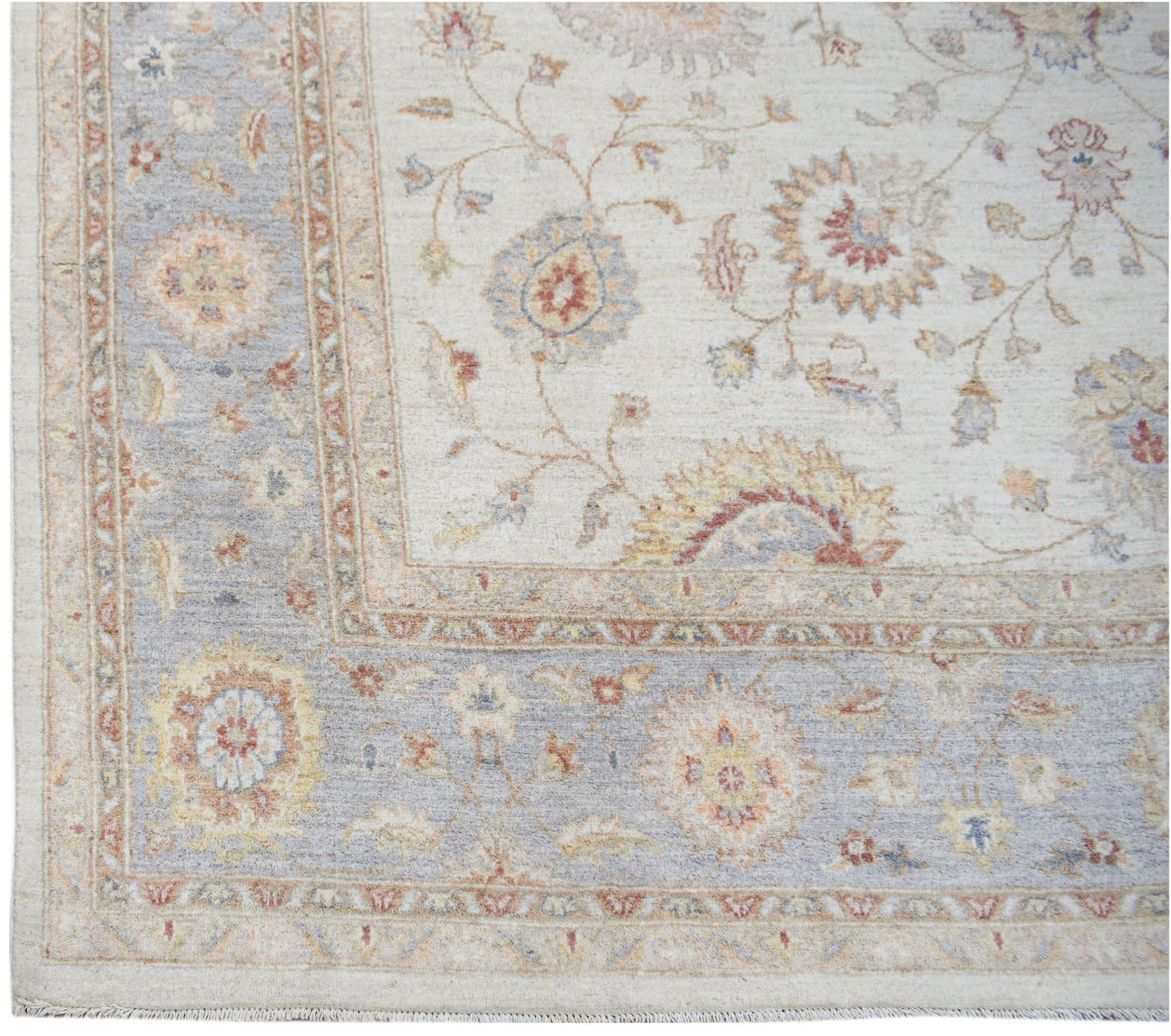 A handmade Afghan Chobi rug featuring a traditional floral pattern in soft, earthy tones.