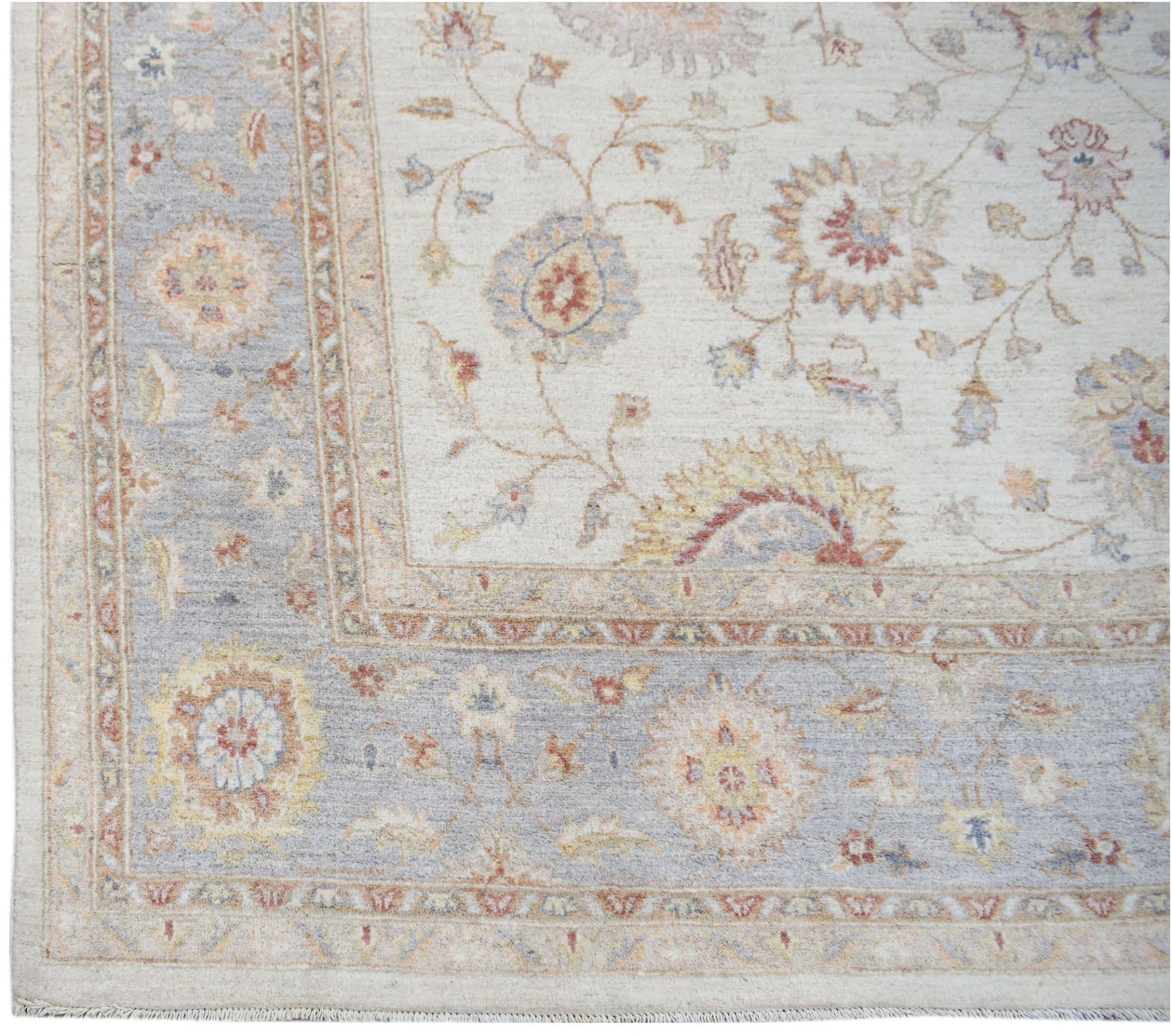 A handmade Afghan Chobi rug featuring a traditional floral pattern in soft, earthy tones.