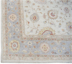 A handmade Afghan Chobi rug featuring a traditional floral pattern in soft, earthy tones.
