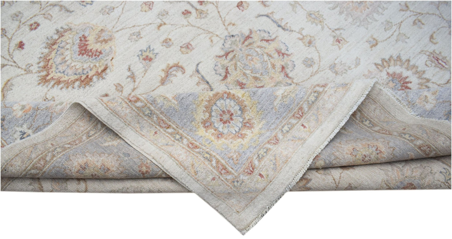 A handwoven Afghan Chobi rug featuring a traditional floral pattern in soft, earthy tones.