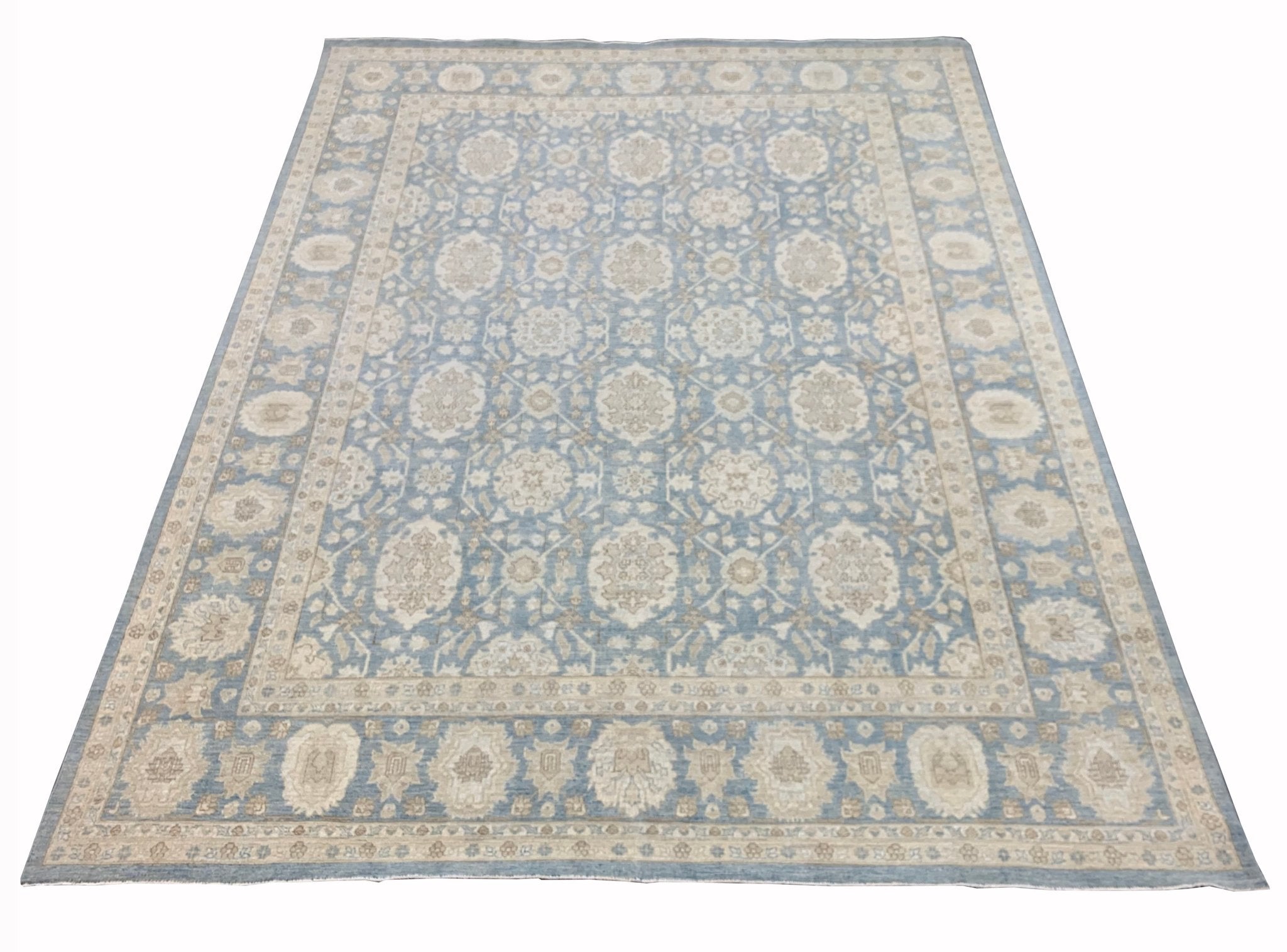 A handmade Afghan Chobi rug featuring a traditional floral pattern in shades of blue and beige.