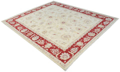 An Afghan Chobi rug featuring a cream field with floral patterns and a wide red border.