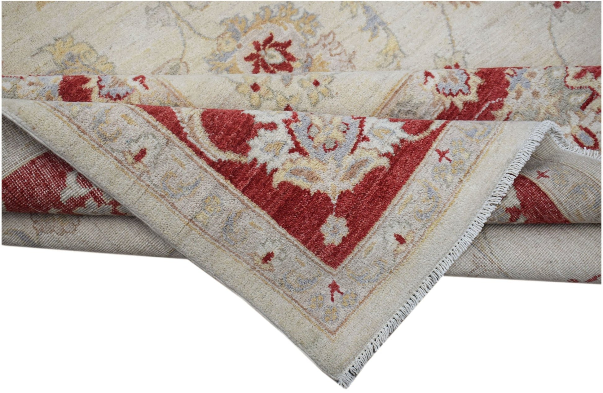A handwoven Afghan Chobi rug featuring a traditional floral pattern in red, cream, and grey tones.