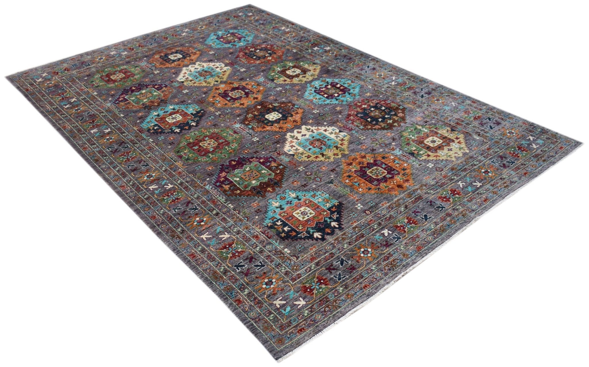 A rectangular Afghan Chobi rug featuring a grey field with colorful geometric medallion patterns.