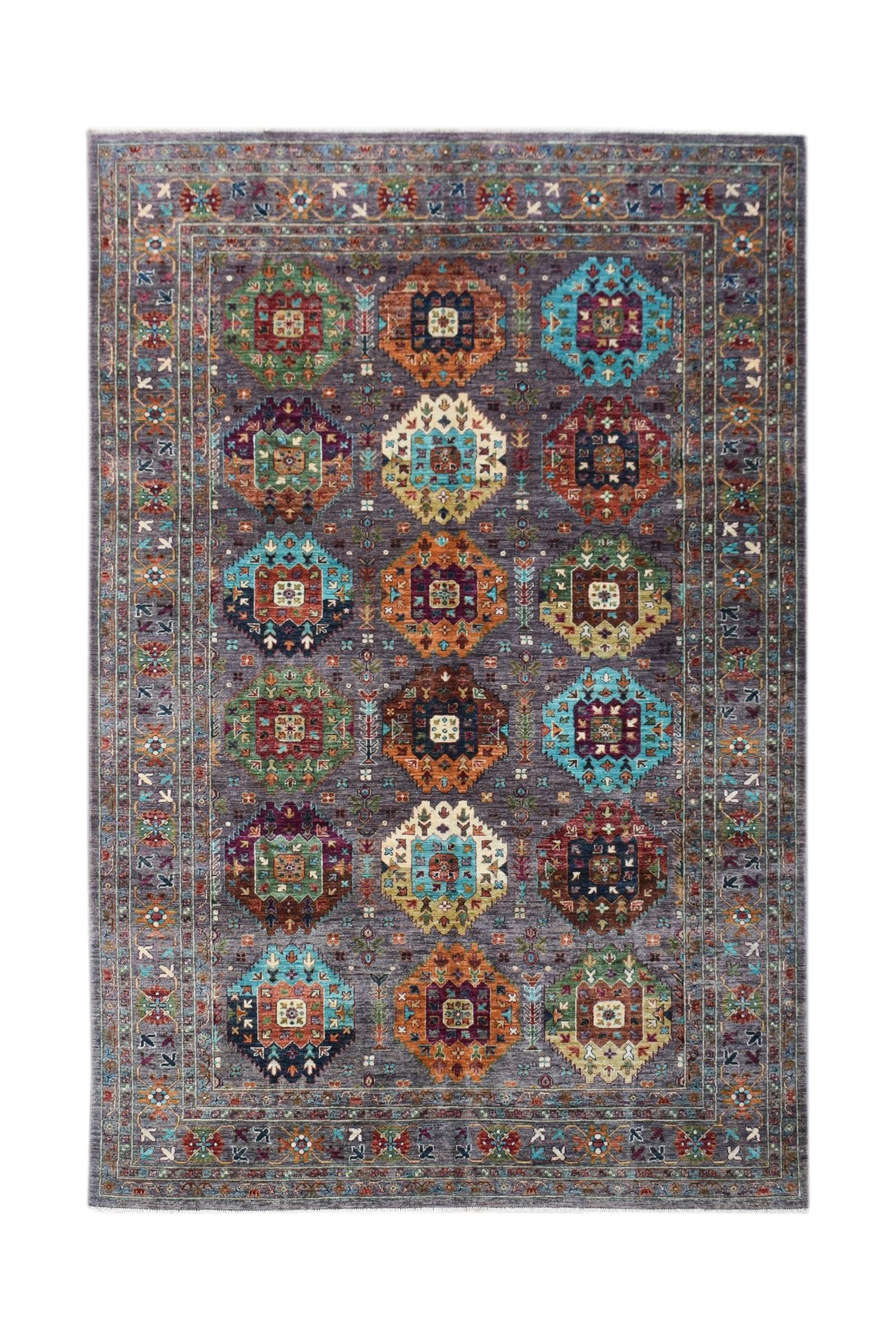 An Afghan Chobi rug featuring a grey field with colorful geometric medallions and a floral border.