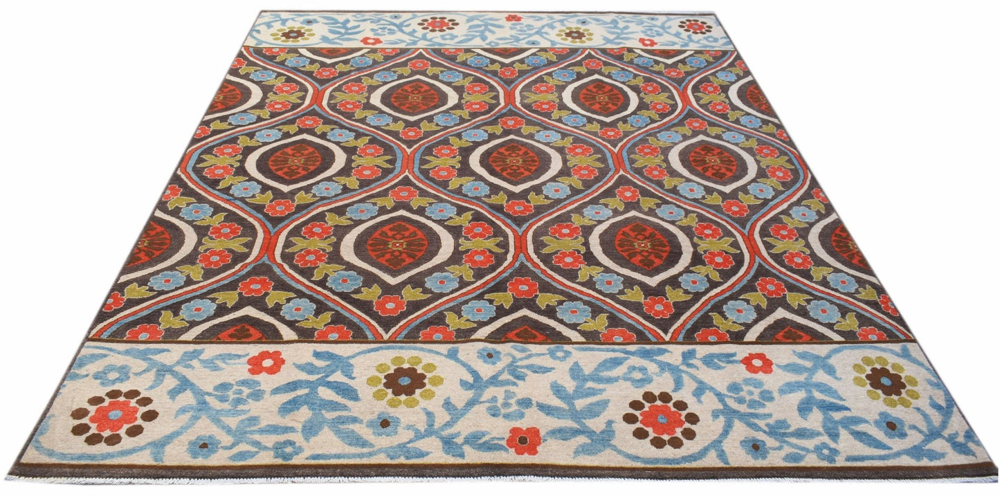 Handmade Afghan Chobi rug featuring a repeating floral medallion pattern in red, blue, and brown.
