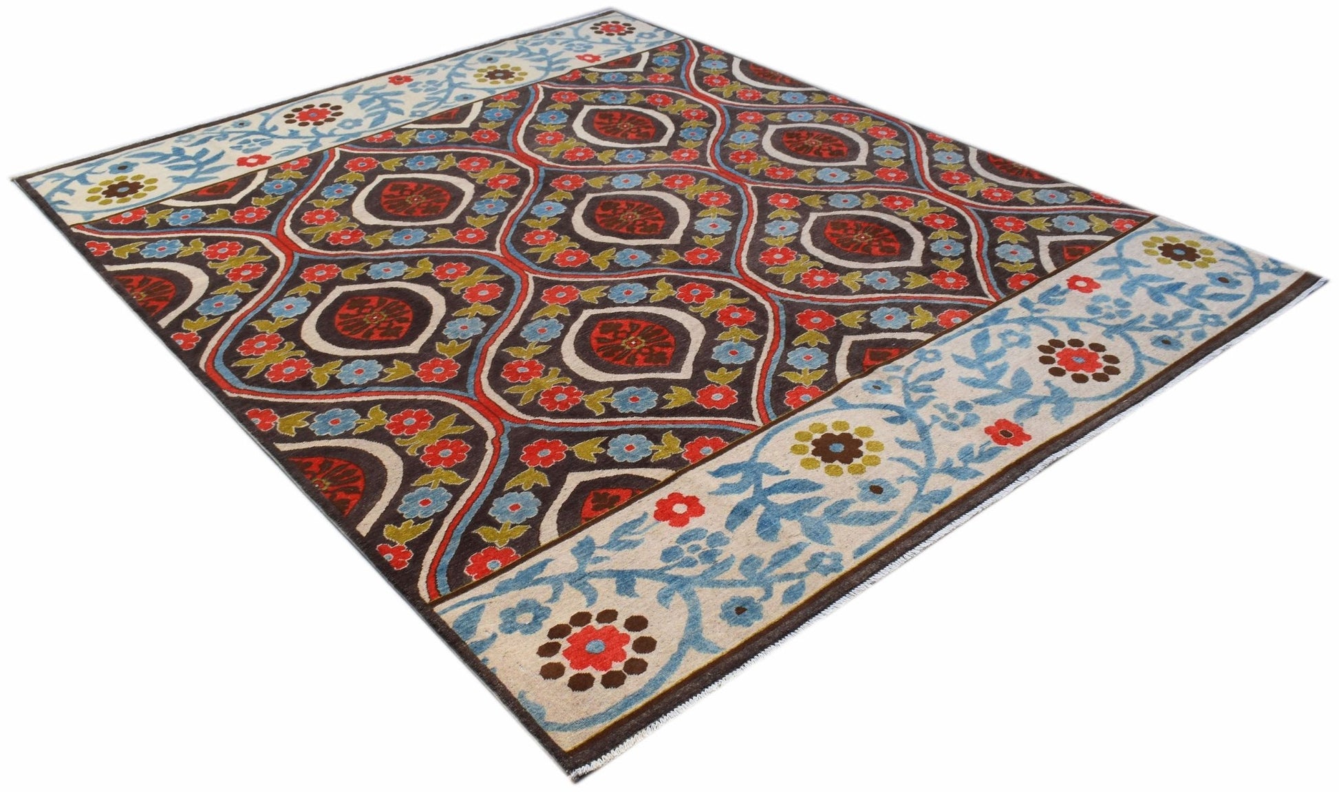 A handmade Afghan Chobi rug featuring a dark brown field with floral motifs and light blue borders.