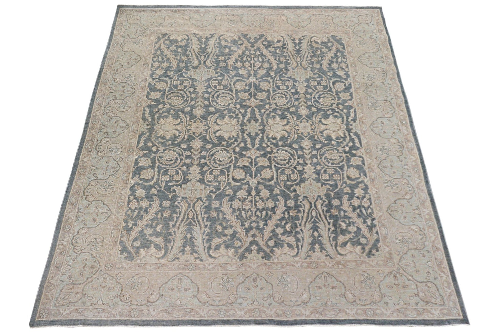 A handmade Afghan Chobi rug featuring a traditional floral pattern in blue and beige tones.