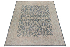 A handmade Afghan Chobi rug featuring a traditional floral pattern in blue and beige tones.