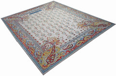 An Afghan Chobi rug featuring a cream field with floral motifs and a vibrant paisley border.