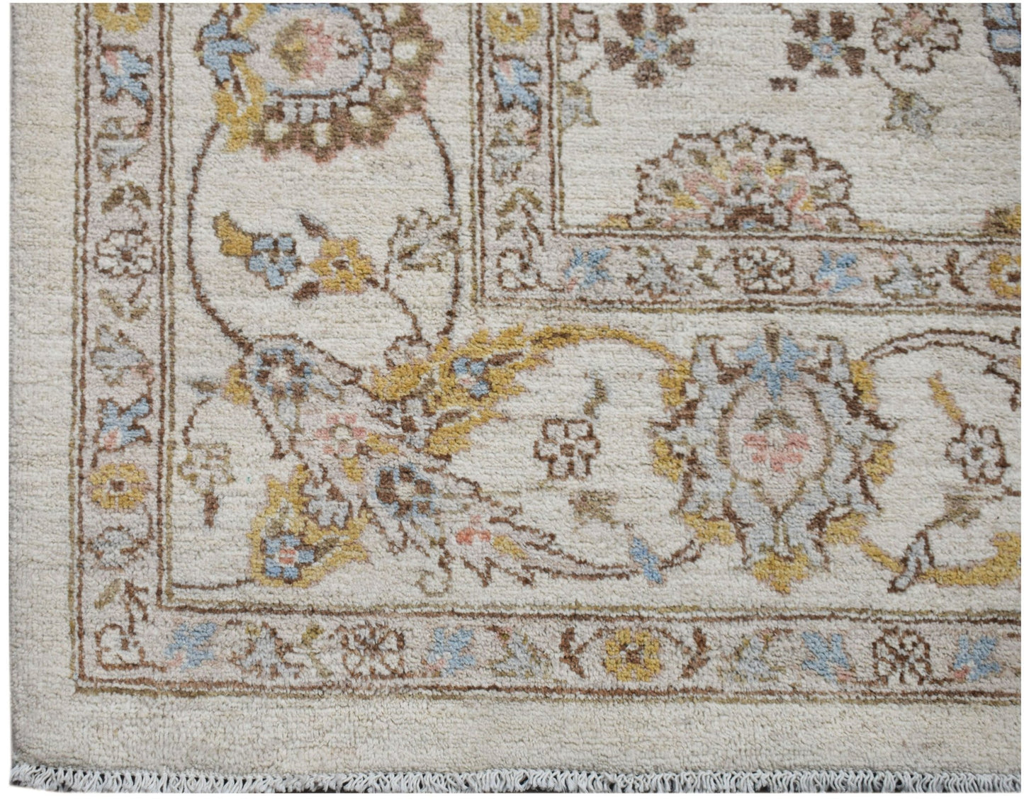 A handwoven Afghan Chobi rug featuring traditional floral patterns in soft, earthy tones.
