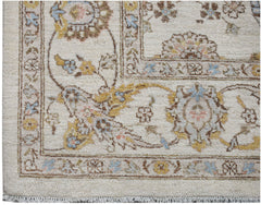 A handwoven Afghan Chobi rug featuring traditional floral patterns in soft, earthy tones.